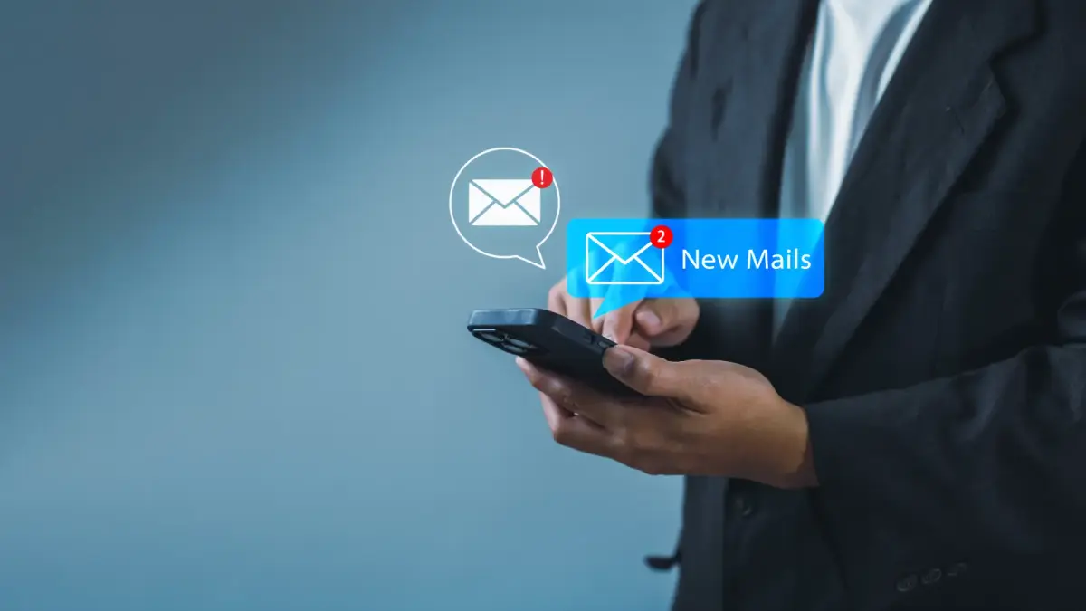 Businessman using smartphone with new email alert. Communication connection messages in global workplaces through email marketing or digital newsletter