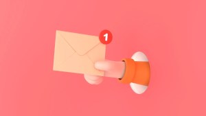 Hand hold an envelope of sending notification icon with e-mail message.